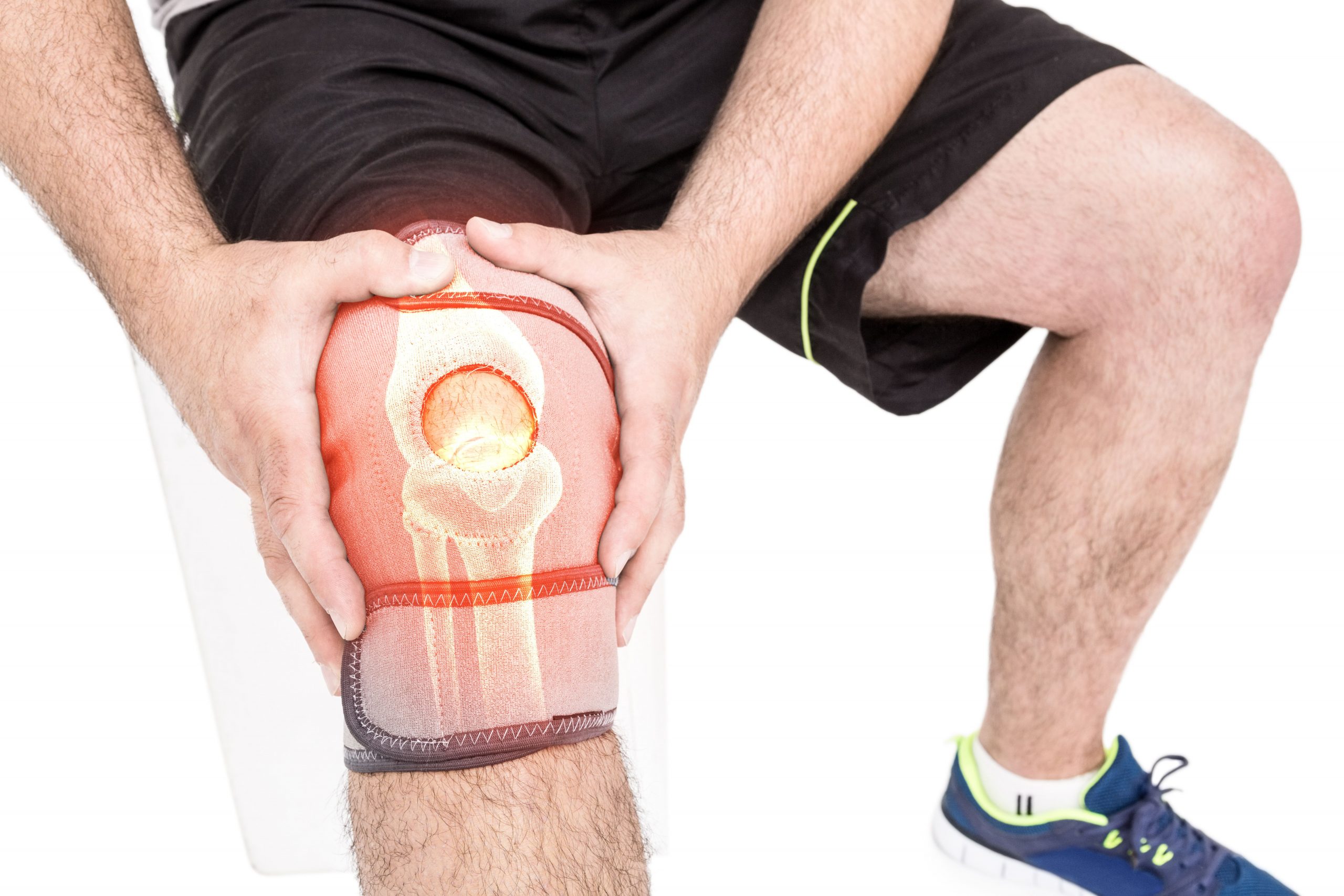 Mid section of man holding sore knee Photo from Pikwizard