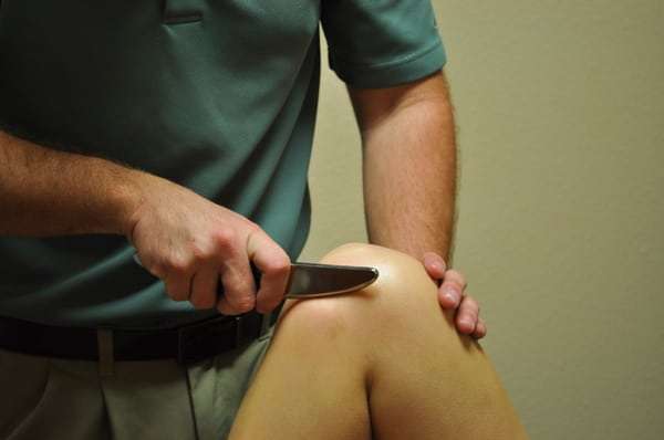 Using Graston to break up scar tissue in the knee from a ...